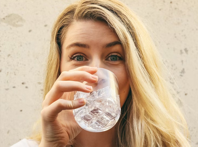 blonde drinking water